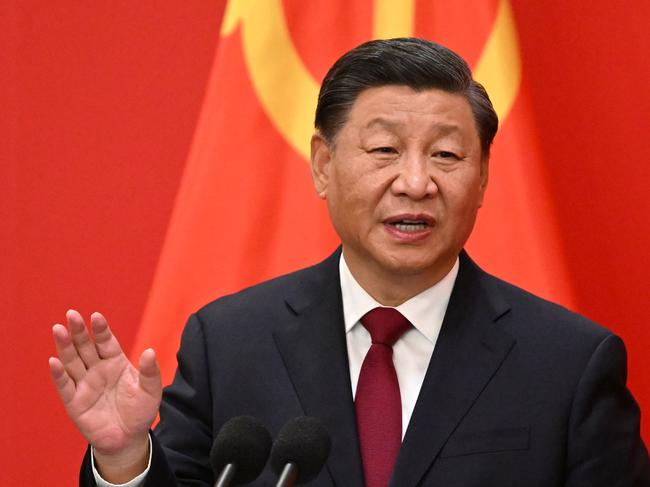 TOPSHOT - China's President Xi Jinping speaks during the introduction of members of the Chinese Communist Party's new Politburo Standing Committee, the nation's top decision-making body, to the media in the Great Hall of the People in Beijing on October 23, 2022. (Photo by Noel CELIS / AFP)