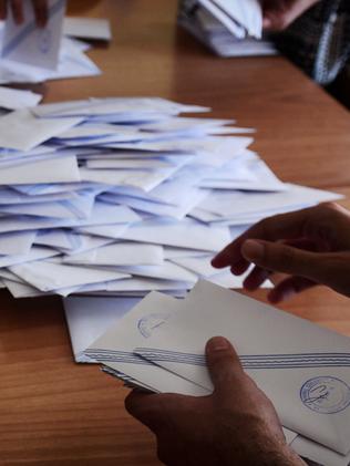 Polling station officials count ballots. Picture: Louisa Gouliamaki