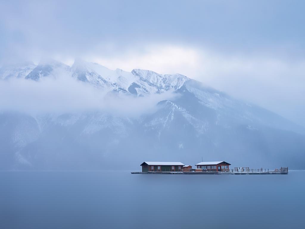 Image Name: Sneak “Peak” Photographer Name: Wee Beng Lim Year: 2018 Image Description: This image was taken in December 2017 at Lake Minnewanka near Banff, Canada. I set out early morning after a long night of snowfall. The light managed to sneak through the small gap in the clouds and allowed me to capture the tranquility of this moment. Copyright: Wee Beng Lim, 2nd place, Singapore National Award. Picture: Sony World Photography Awards/ Wee Beng Lim