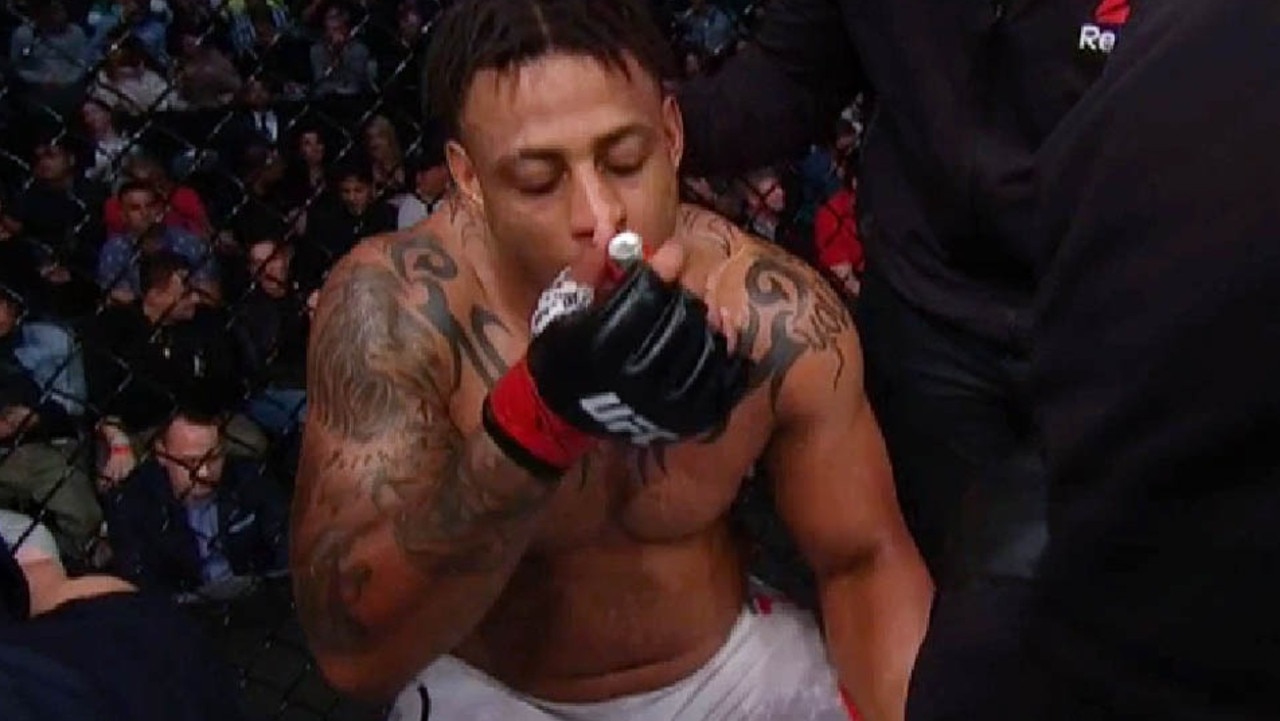 Greg Hardy took a puff of his inhaler between rounds.