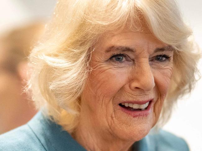 Britain's Queen Camilla (C) talks with volunteers and visitors to the centre after officially opening 'Maggie's Royal Free', a new cancer support centre, at the Royal Free Hospital in east London on January 31, 2024. (Photo by Paul Grover / POOL / AFP)