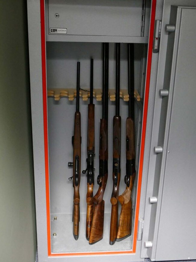 A number of the rifles in a storage safe.