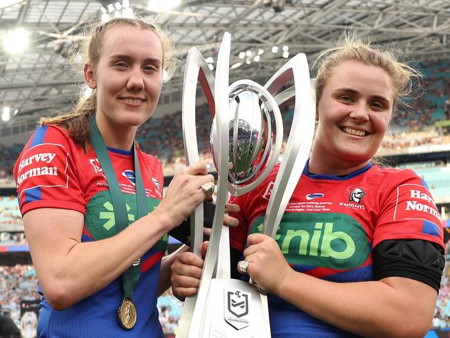 SYDNEY, AUSTRALIA - OCTOBER 01: Tamika Upton and Hannah Southwell of the Knights poses with the Premiership Trophy after winning the 2023 NRLW Grand Final match between Newcastle Knights and Gold Coast Titans at Accor Stadium, on October 01, 2023, in Sydney, Australia. (Photo by Matt King/Getty Images)