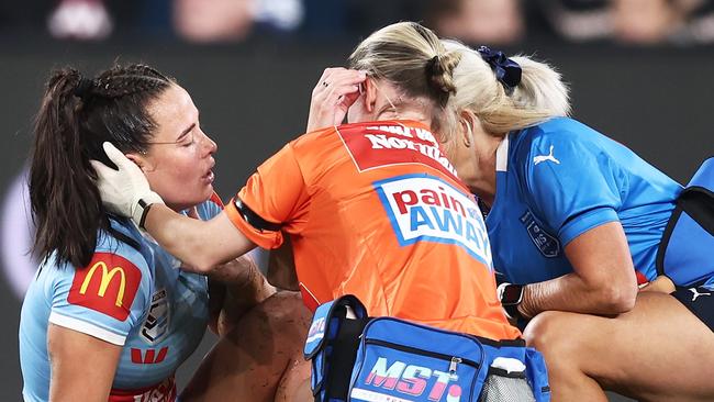 SYDNEY, AUSTRALIA - JUNE 01:  Isabelle Kelly of the Blues is assisted on the field after sustaining an injury during game one of the Women's State of Origin series between New South Wales and Queensland at CommBank Stadium on June 01, 2023 in Sydney, Australia. (Photo by Matt King/Getty Images)