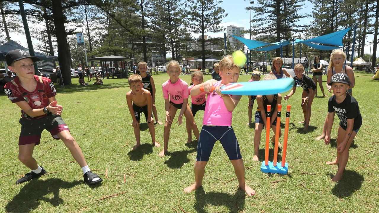 People celebrating Australia Day at Burleigh Heads. Burleigh Heads SLSC Nippers playing with cricket Hugh Gordon, 7, of Burleigh. Pic Mike Batterham