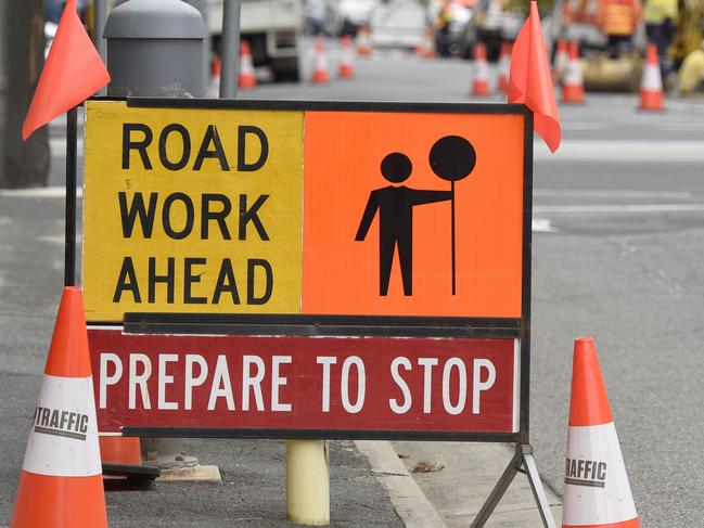 MELBOURNE, AUSTRALIA - NewsWire Photos FEBRUARY 15, 2022: Generic stock images of construction crews. Workers at a sewage infrastructure in inner Melbourne with a Road Work Ahead sign in the foreground. Picture: NCA NewsWire / Andrew Henshaw