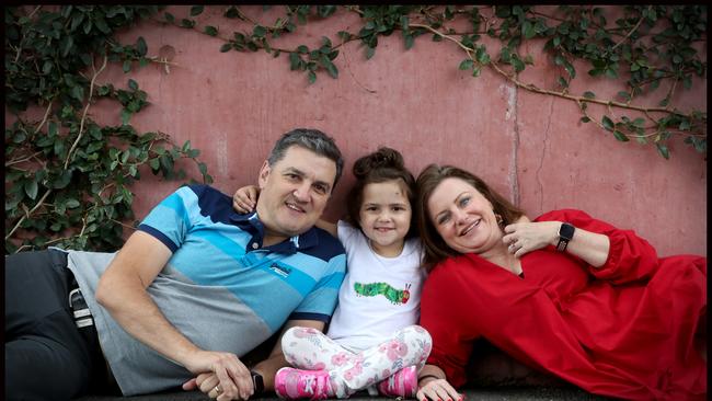 Ava Pearce, 4, with her parents Amanda and Damien Pearce. Picture: Jamie Hanson