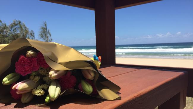 Flowers left in memory of the nine-month-old girl who was found dead on Surfers Paradise beach. Picture: Talisa Eley