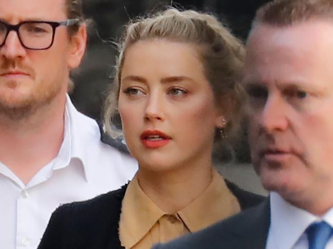 US actress Amber Heard leaves after giving evidence at the libel trial by her former husband US actor Johnny Depp against News Group Newspapers (NGN), at the High Court in London, on July 22, 2020. - US actress Amber Heard on Wednesday said her ex-husband Johnny Depp threw dozens of bottles at her "like grenades", as she gave evidence for a third day at his London libel action. (Photo by Tolga AKMEN / AFP)