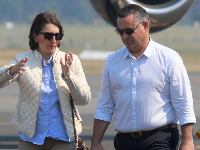 Daily Telegraph.  NSW Premier Gladys Berejiklian, Deputy Premier John Barilaro arrive at Port Macquarie airport with RFS volunteers.    Picture Nathan Edwards.