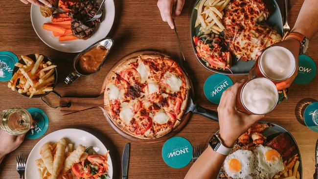 Food at The Claremont Hotel (The Mont). Clockwise from bottom left: fish &amp; chips, scotch fillet, parmi, mixed grill and pizza (centre). Picture: Supplied