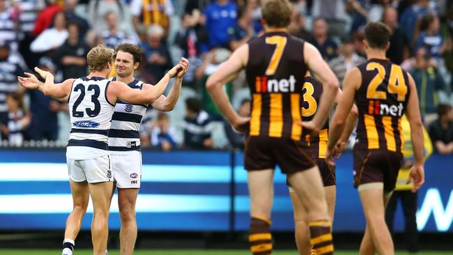 MELBOURNE, VICTORIA - MARCH 28: Patrick Dangerfield of the Cats celebrates with Josh Caddy of the Cats after winning the round one AFL match between the Geelong Cats and the Hawthorn Hawks at the Melbourne Cricket Ground on March 28, 2016 in Melbourne, Australia. (Photo by Scott Barbour/AFL Media/Getty Images)