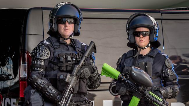 Victoria Police public order squad officers armed with their new non-lethal weapons. Picture: Jake Nowakowski