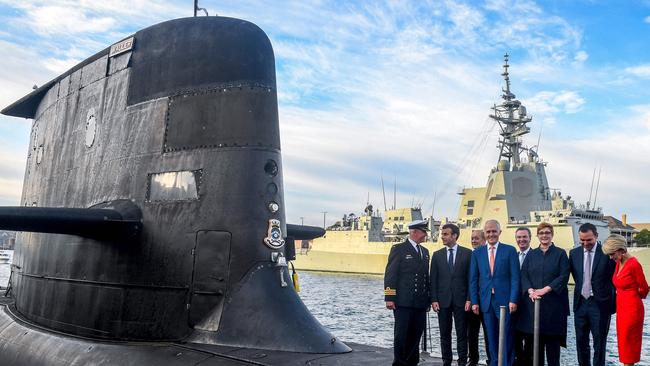 French President Emmanuel Macron and then Australian PM Malcolm Turnbull standing on the deck of HMAS Waller, a Collins-class submarine operated by the Royal Australian Navy, in 2018. Picture: Brendan Esposito/AFP