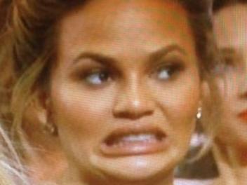 Chrissy Teigen explains THAT Oscars face