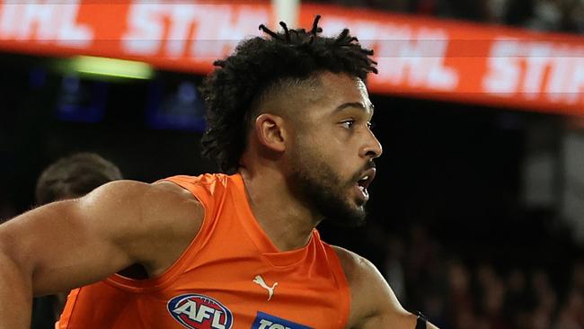 MELBOURNE, AUSTRALIA - MAY 11: Connor Idun of the Giants controls the ball during the round nine AFL match between Essendon Bombers and Greater Western Sydney Giants at Marvel Stadium, on May 11, 2024, in Melbourne, Australia. (Photo by Robert Cianflone/Getty Images)