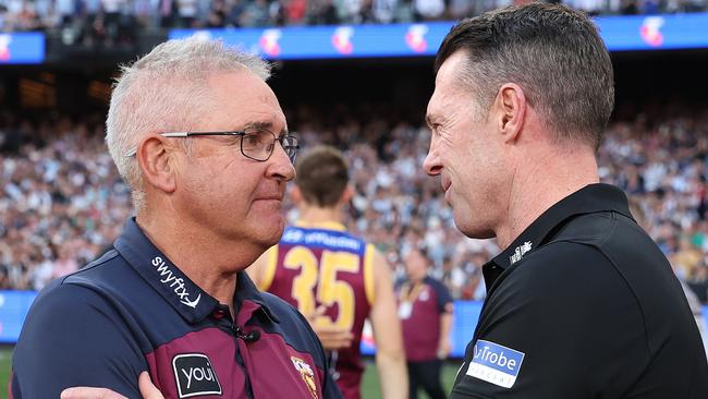 MELBOURNE, AUSTRALIA - SEPTEMBER 30: Lions coach Chris Fagan is acknowledged by Magpies coach Craig McRae during the 2023 AFL Grand Final match between Collingwood Magpies and Brisbane Lions at Melbourne Cricket Ground, on September 30, 2023, in Melbourne, Australia. (Photo by Robert Cianflone/AFL Photos/via Getty Images)