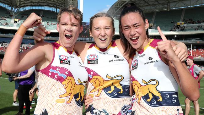 Dakota Davidson, Taylor Smith and Jesse Wardlaw celebrate their premiership. Picture: Sarah Reed/AFL Photos via Getty Images