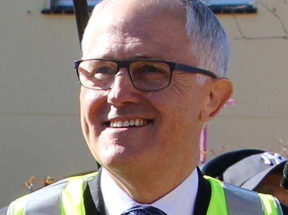 Bradfield federal Liberal MP and Minister for Territories, Local Government and Major Works Paul Fletcher with Assistant Minister for Productivity Dr Peter Hendy and Prime Minister Malcolm Turnbull laying NBN infrastructure earlier this year. Supplied.