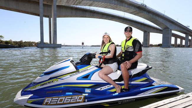 Cr Lisa Atwood tries out a jet ski with Christian Dewilzem from Yamaha, which is based near the new Murarrie Recreation Hub. Picture: AAP/Jono Searle