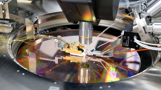 A silicon wafer, designed by PsiQuantum, contains computing chips.