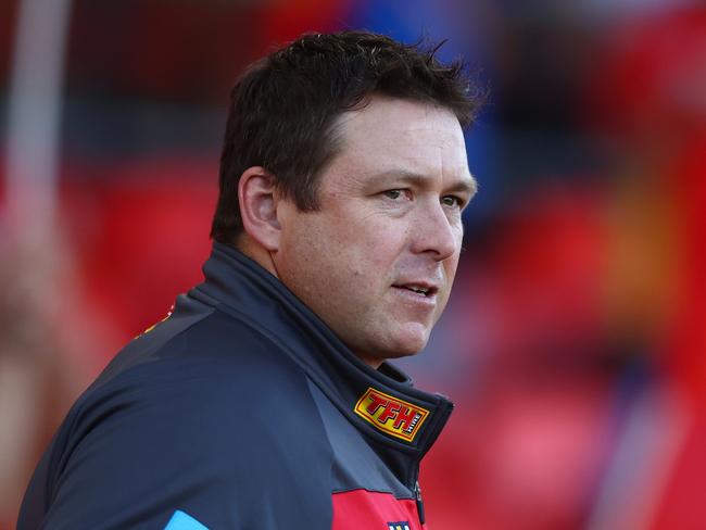 GOLD COAST, AUSTRALIA - APRIL 23: Suns coach Stuart Dew looks on during the round six AFL match between Gold Coast Suns and North Melbourne Kangaroos at Heritage Bank Stadium, on April 23, 2023, in Gold Coast, Australia. (Photo by Chris Hyde/Getty Images)