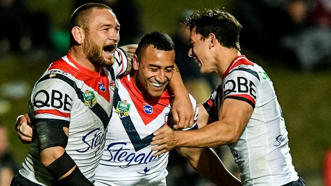 Sio Siua Taukeiaho of the Roosters (centre) reacts after scoring a try during the Round 19 NRL match between the Manly-Warringah Sea Eagles and the Sydney Roosters at Lottoland in Sydney, Sunday, July 22, 2018. (AAP Image/Brendan Esposito) NO ARCHIVING, EDITORIAL USE ONLY