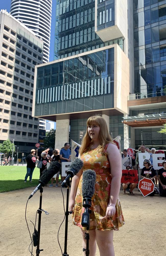 Anti-Adani protesters outside the Brisbane Supreme Court as vocal activist Ben Pennings is locked in a bitter legal battle with the mining giant. Pictured is Mr Pennings’ oldest daughter Isabella with protesters. Picture: Danielle O'Neal