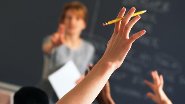 Teacher pointing to raised hands in classroom, Classroom, teaching generic, education generic, Teacher, Learning, Hand Raised, Education, Adult, School Building, Pointing, Standing, Image, Women, Adults Only, Colour Image, Horizontal, Human Arm, Human Body Part, Human Limb, Incidental People, Indoors, Limb, One Person, Only Women, People, Photography, thinkstock, generic, istock