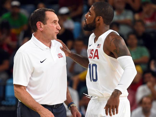 Coach Mike Krzyzewski (L) talks to Kyrie Irving during USA v Venezuela.