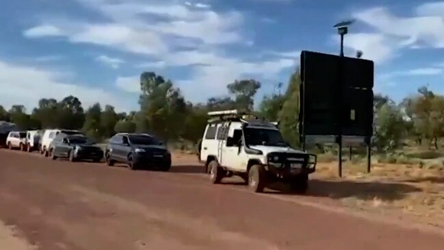 Caravans back on the road and able to leave William Creek, in SA's outback, after roads reopened following heavy downpours and flash flooding. Picture: 7NEWS