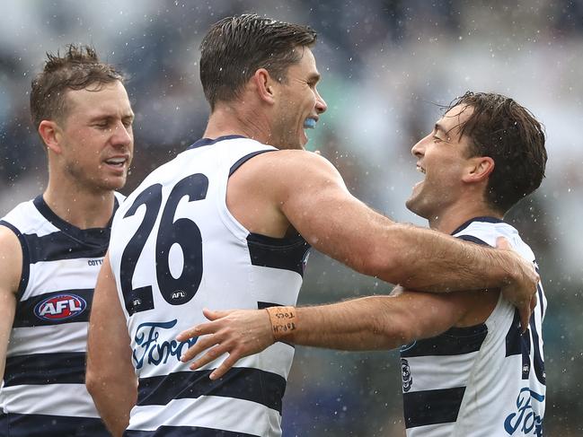 GEELONG, AUSTRALIA - APRIL 24: Tom Hawkins of the Cats celebrates with Luke Dahlhaus after scoring a goal during the round six AFL match between the Geelong Cats and the West Coast Eagles at GMHBA Stadium on April 24, 2021 in Geelong, Australia. (Photo by Robert Cianflone/Getty Images)