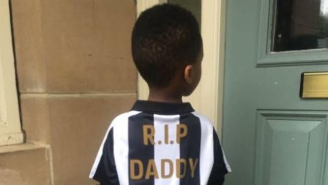 Cheick Tiote's son poses in a Newcastle shirt.
