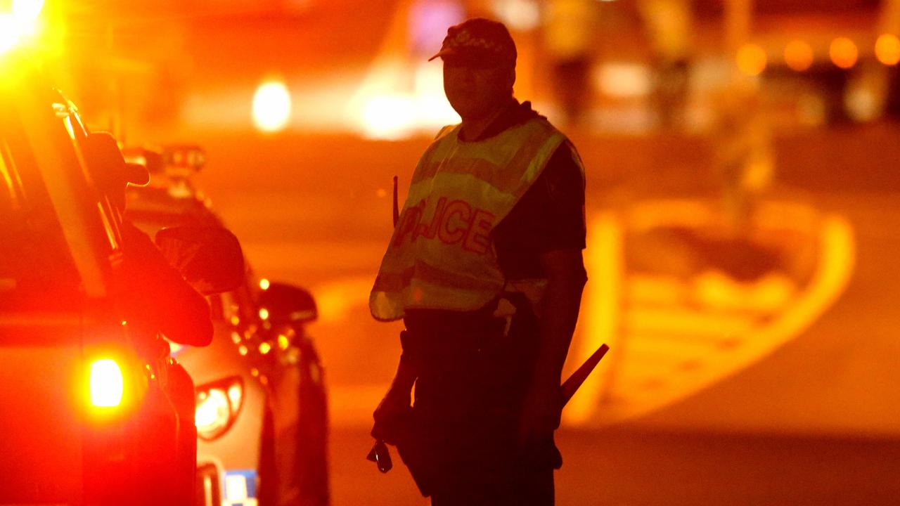 A police officer at the scene of the Alexandra Hills crash on Tuesday night. Picture: Steve Pohlner