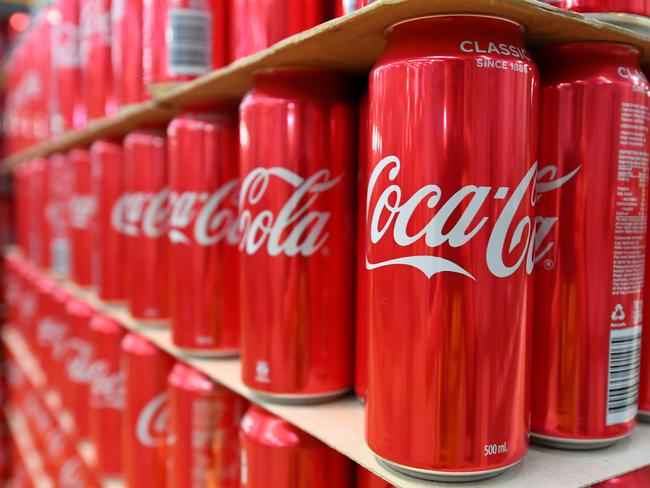 Cans of coke are seen at the Coca Cola factory in Melbourne, Tuesday, February 25, 2020. Andrews has announced a $96.5mil package to improve Victoria's recycling industry. (AAP Image/James Ross) NO ARCHIVING