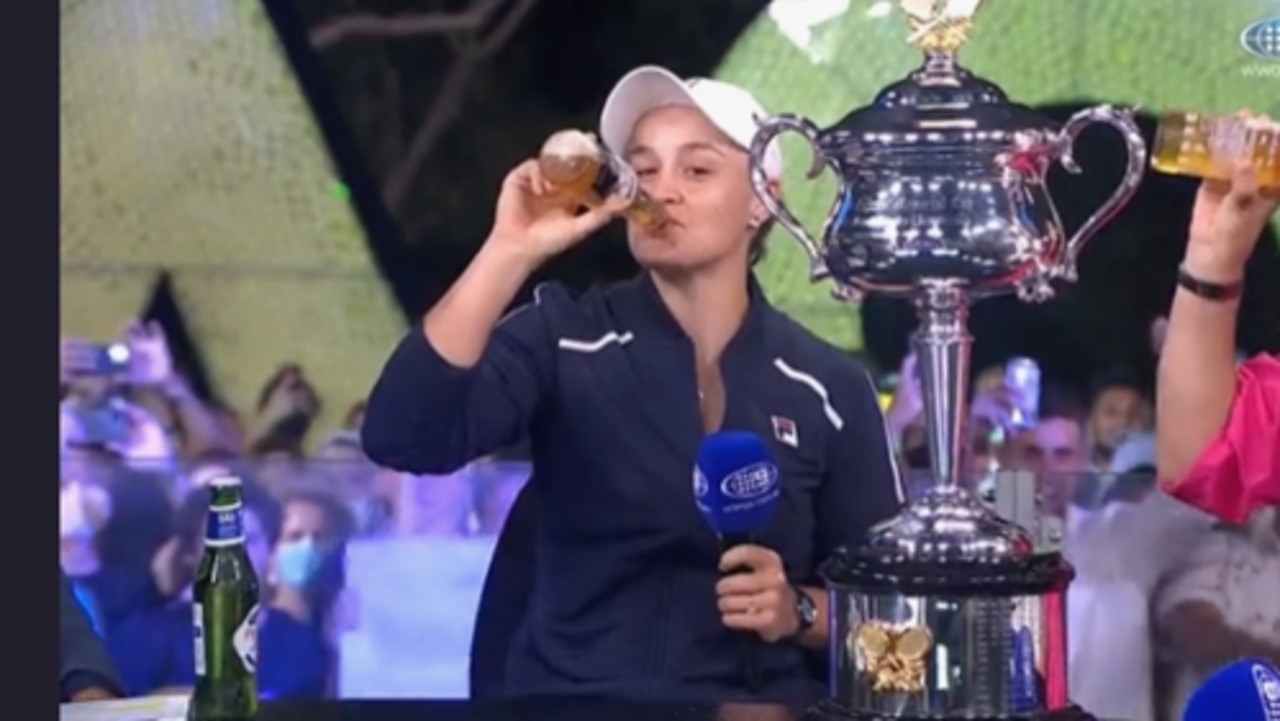 Ash Barty celebrates her 2022 Australian Open win with a beer during an interview on Channel 9 on Saturday, January 29, 2022. Picture: Supplied