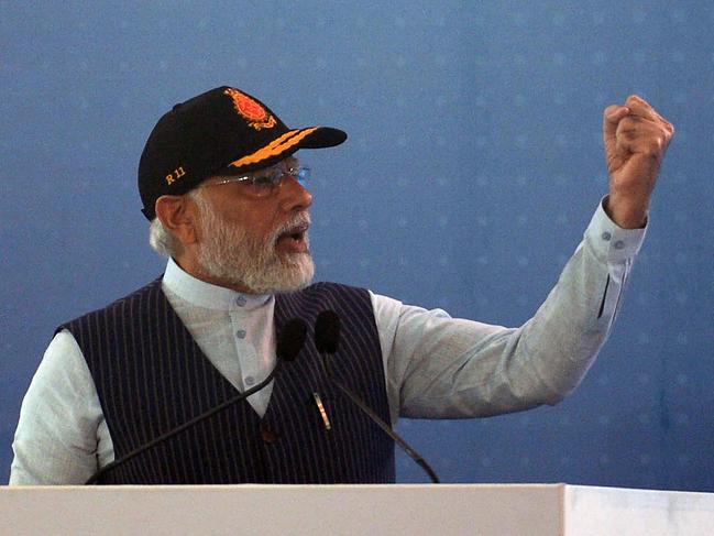 Indian Prime Minister Narendra Modi gestures as he speaks during the commissioning of the  Indian indigenous aircraft carrier INS Vikrant at Cochin Shipyard in Kochi on September 2, 2022. - India debuted its first locally made aircraft carrier on September 2, a milestone in government efforts to reduce its dependence on foreign arms and counter China's growing military assertiveness in the region. (Photo by Arun SANKAR / AFP)