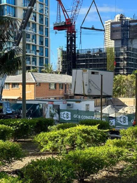 A site building is removed from the Drift development at Hughes Avenue, Main Beach on Friday morning May 12. Credit: Gold Coast Bulletin