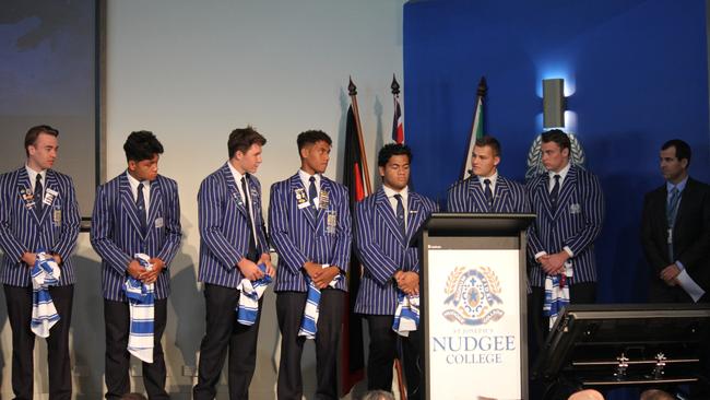 First XV coach Andrew Scotney (far right) and the Nudgee College First XV presented with their jerseys at this week's school assembly. Picture: Nudgee College
