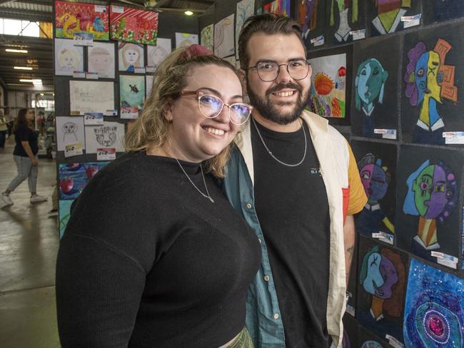 Sharnee McGrath and Connor Bowtell check out the artwork in the pavilion. Toowoomba Royal Show. Saturday, April 1, 2023. Picture: Nev Madsen.