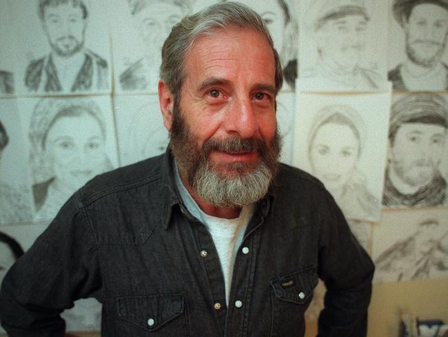 Chaim Topol in his dressing room at the Regent Theatre with some of his sketches. p/. Undated. /actors  headshot actor art drawings