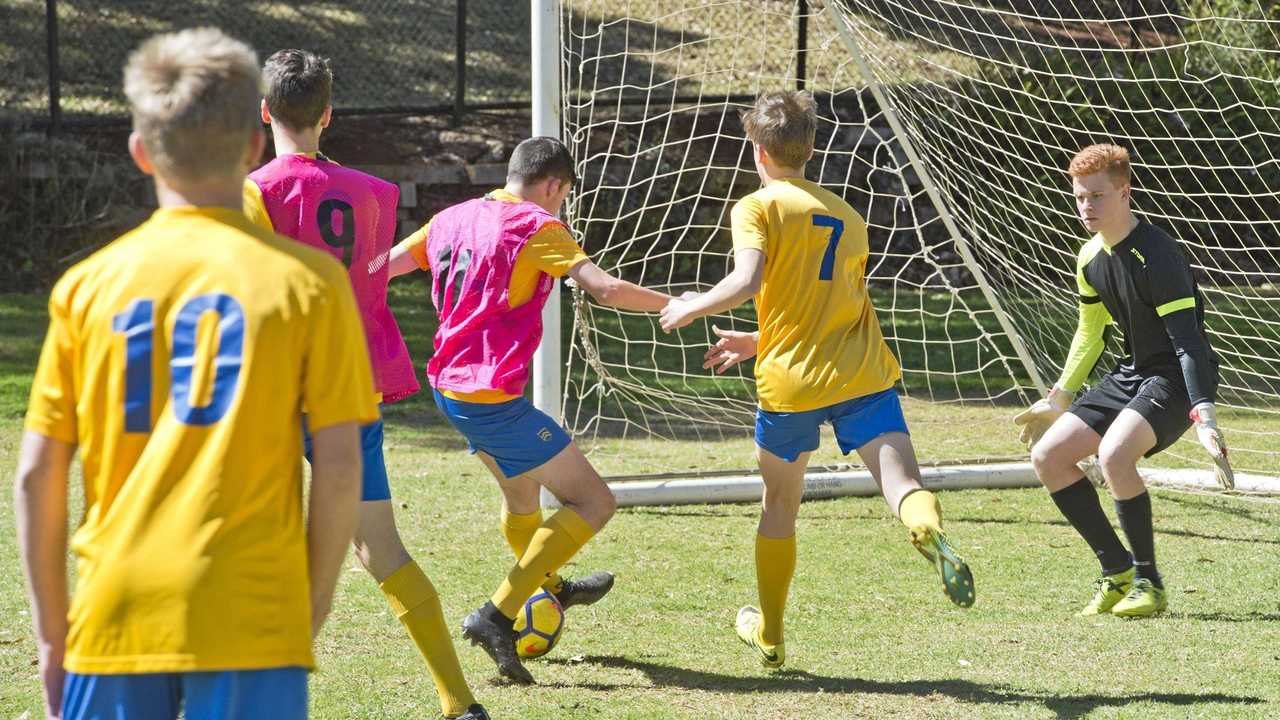 CUP CLASH: Toowoomba Grammar School's Bill Turner Cup team gets  in a contested training session ahead of their national semi-final match against  Bossley Park High School today. Picture: Nev Madsen