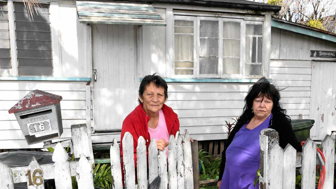 FLOOD DAMAGE: Cheryl Jones and Jackie Jensen need some community assistance in repairing their fence, which was damaged in the 2013 floods. Picture: Mike Knott BUN060718FENCE2