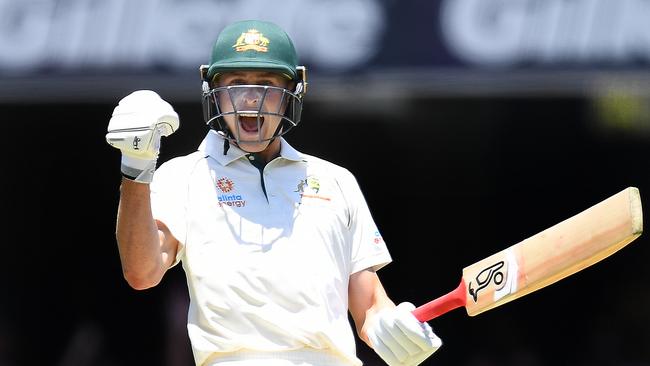 Australian batsman Marnus Labuschagne  reacts after scoring a century on day three of the first Test Match between Australia and Pakistan at the Gabba in Brisbane, Saturday, November 23, 2019. (AAP Image/Dave Hunt) NO ARCHIVING, EDITORIAL USE ONLY, IMAGES TO BE USED FOR NEWS REPORTING PURPOSES ONLY, NO COMMERCIAL USE WHATSOEVER, NO USE IN BOOKS WITHOUT PRIOR WRITTEN CONSENT FROM AAP