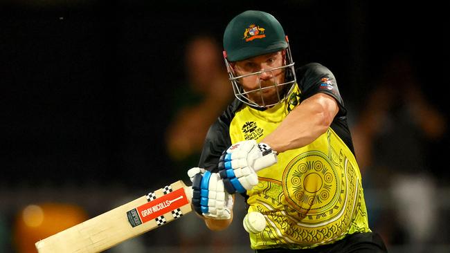 Australia's Captain Aaron Finch plays shot during the ICC men's Twenty20 World Cup 2022 cricket match between Australia and Ireland at The Gabba on October 31, 2022 in Brisbane. (Photo by Patrick Hamilton / AFP) / -- IMAGE RESTRICTED TO EDITORIAL USE - STRICTLY NO COMMERCIAL USE --