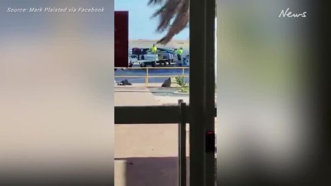 Baggage handler caught throwing luggage