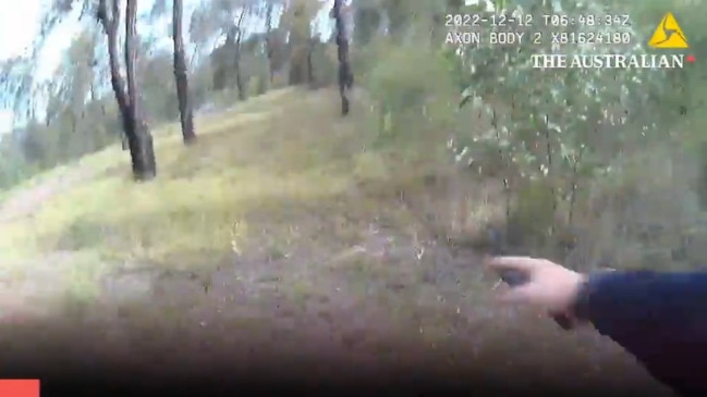 Constable Randall Kirk runs back towards his car