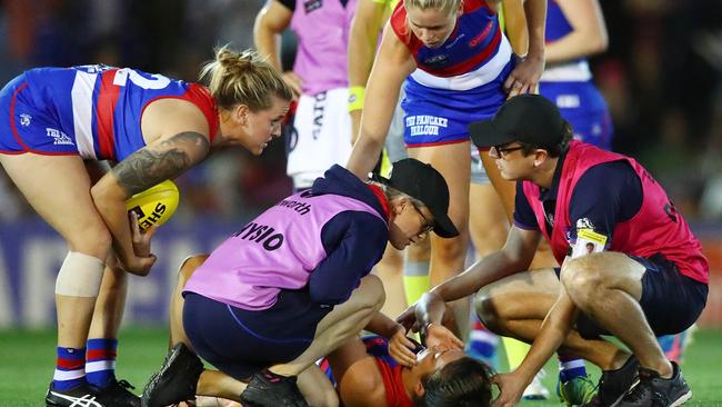 Ellie Blackburn is attended to after copping a heavy knock. Picture: Getty Images