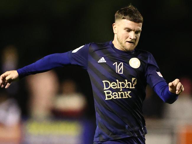 MELBOURNE, AUSTRALIA - AUGUST 31: Joe Guest of the Oakleigh Cannons runs with the ball during the Australia Cup Quarter Final match between Oakleigh Cannons FC and Sydney FC at Jack Edwards Reserve, on August 31, 2022 in Melbourne, Australia. (Photo by Robert Cianflone/Getty Images)