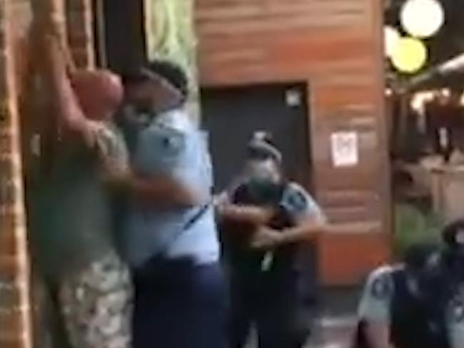 Two charged with assaulting police at Wetherill Park. Dramatic footage has been captured of two 'anti-maskers' being arrested by Police at Wetherill Park.Picture: 9 News